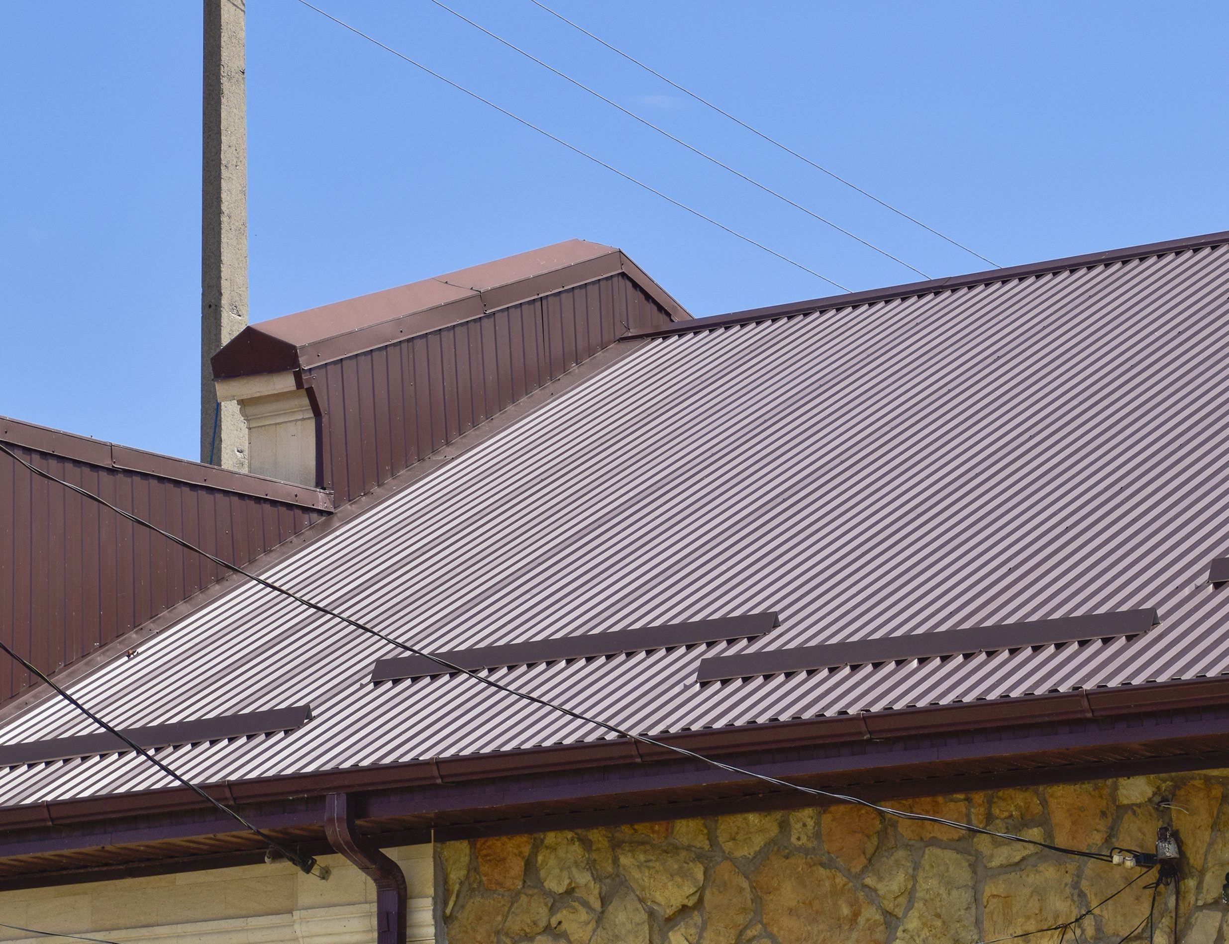 The roof of corrugated sheet. Roofing of metal profile wavy shape.